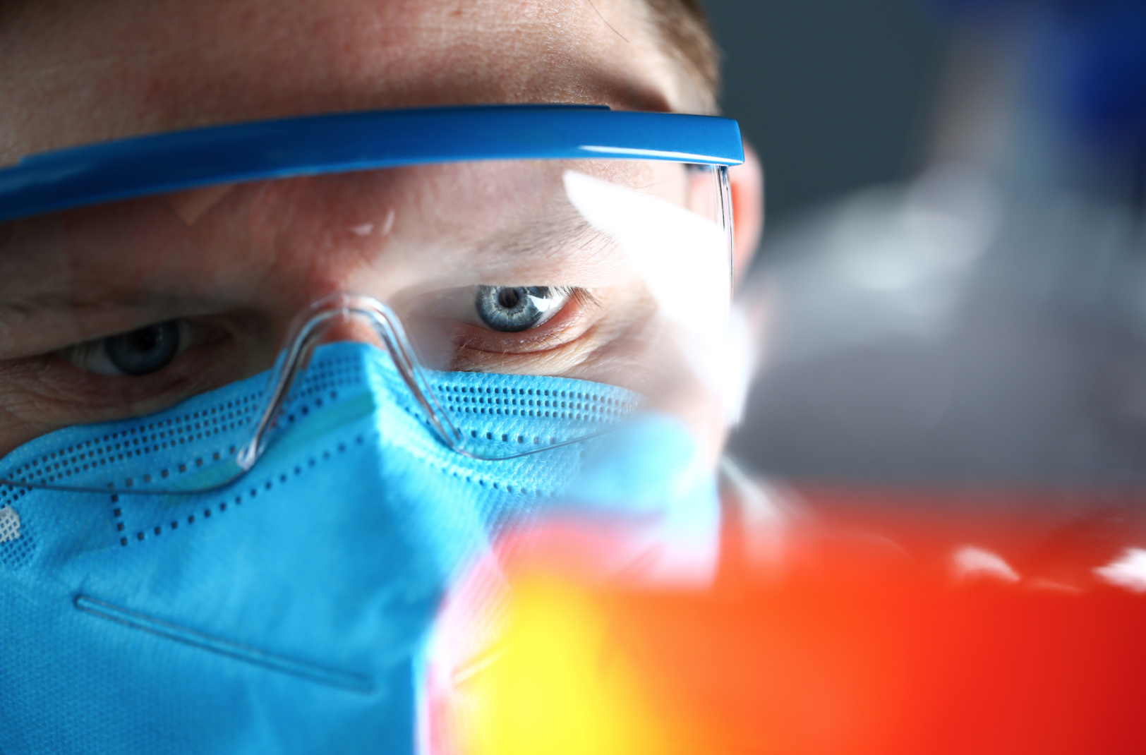 Resting your glasses over your face mask may help.